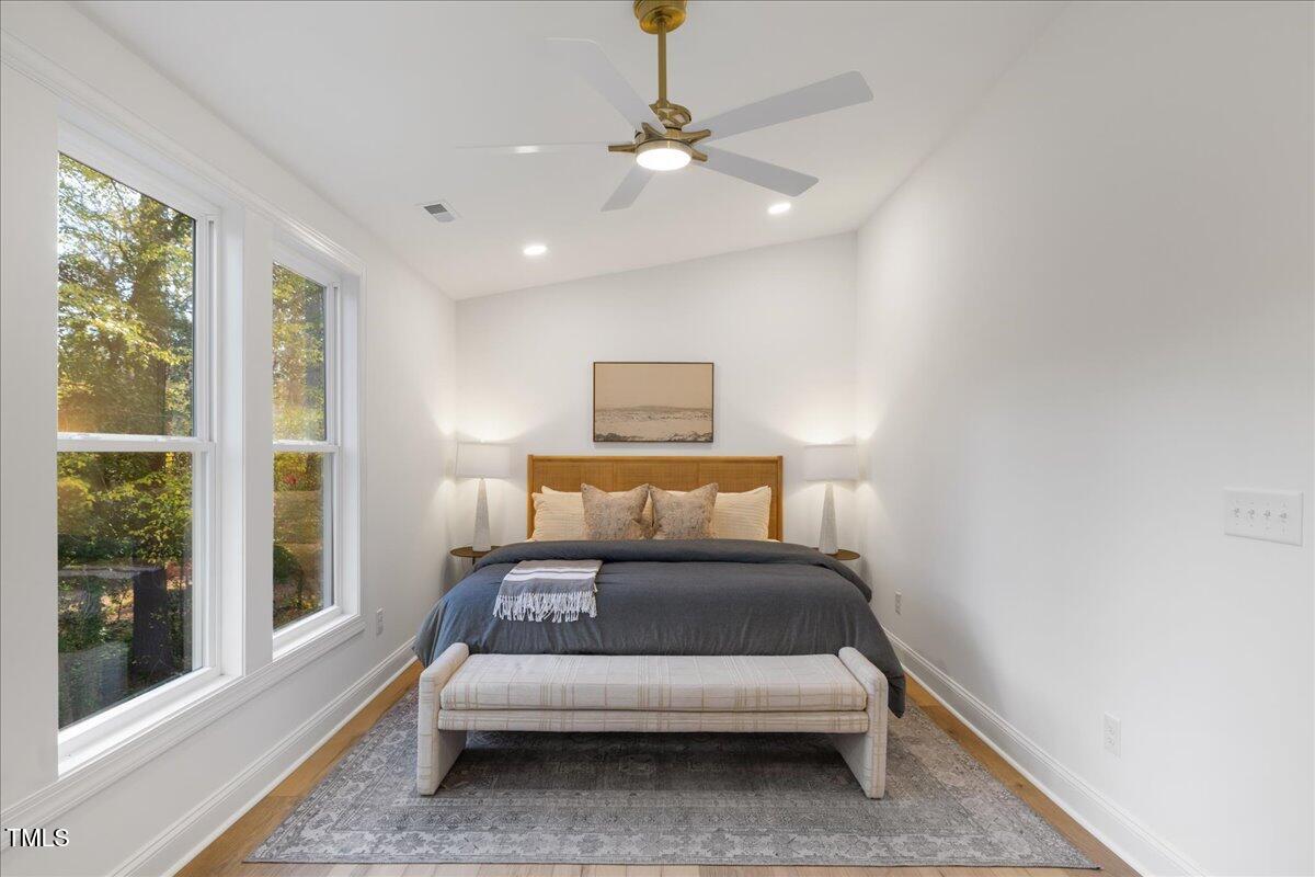 2703 Augusta Drive Durham, NC 27707 - Photo 31 of 45 a bedroom with a bed and large window