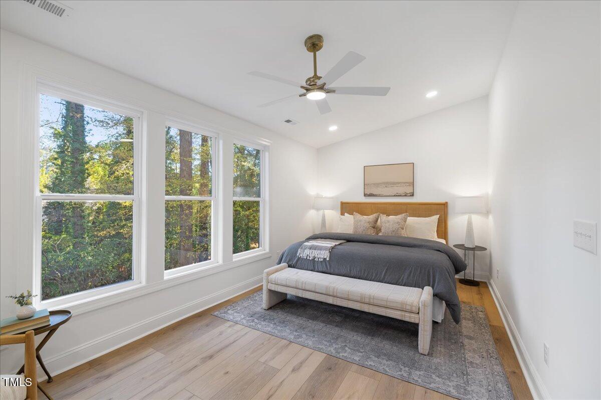 2703 Augusta Drive Durham, NC 27707 - Photo 32 of 45 a bedroom with a large bed and a window