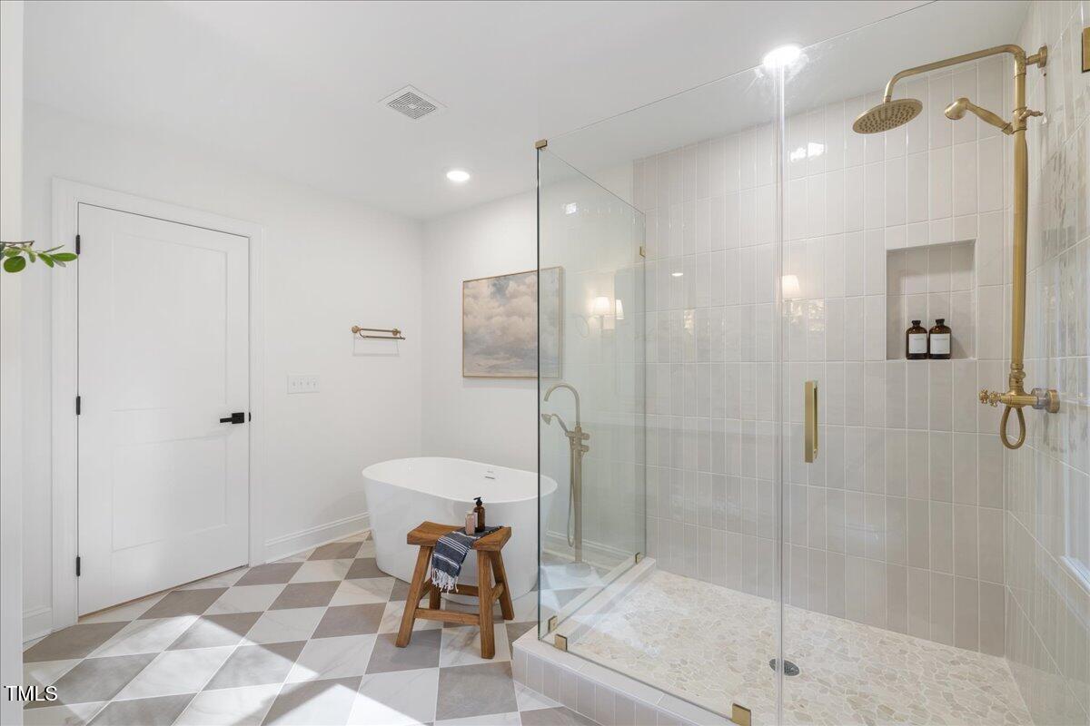 2703 Augusta Drive Durham, NC 27707 - Photo 36 of 45 a bathroom with a shower and a toilet