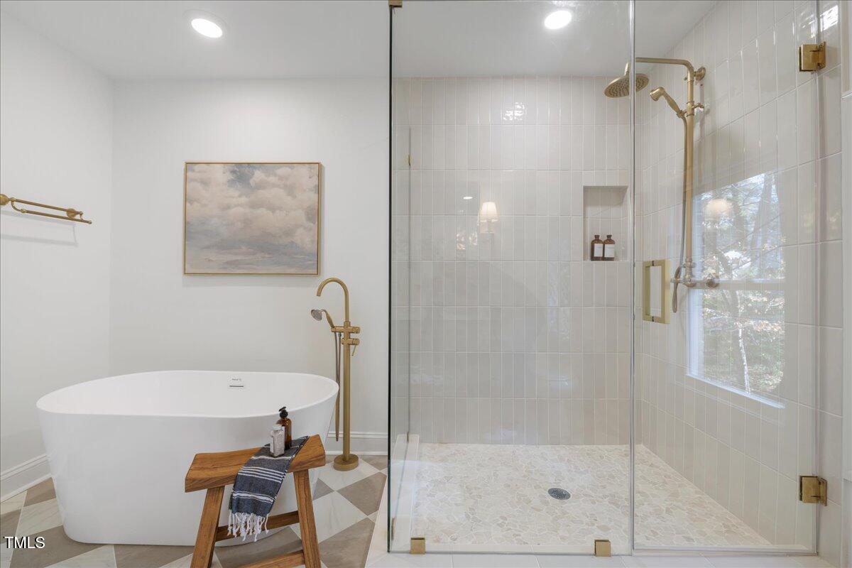 2703 Augusta Drive Durham, NC 27707 - Photo 37 of 45 a bathroom with a bathtub and shower