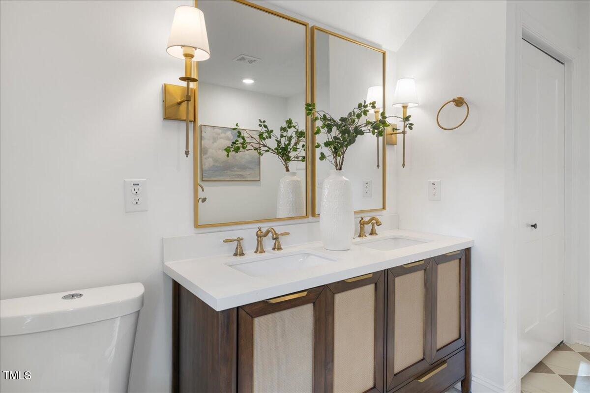 2703 Augusta Drive Durham, NC 27707 - Photo 39 of 45 a bathroom with a sink and a toilet