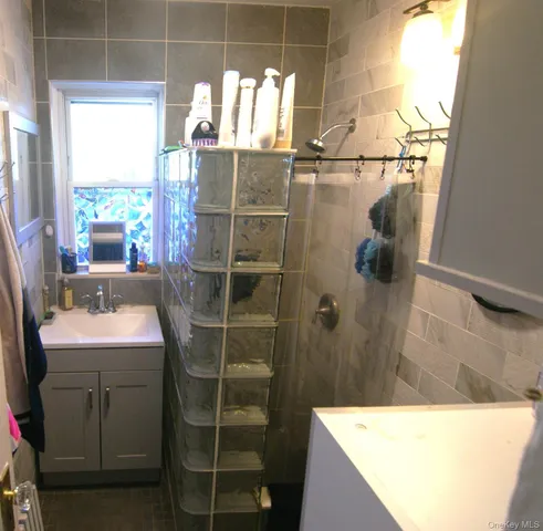a bathroom with a sink and mirror