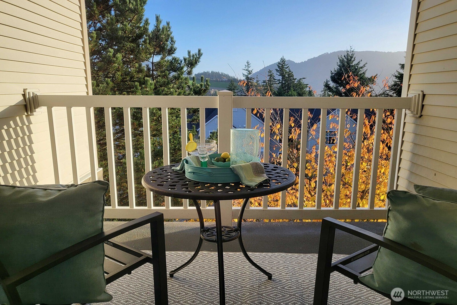 a view of a chairs and table in patio