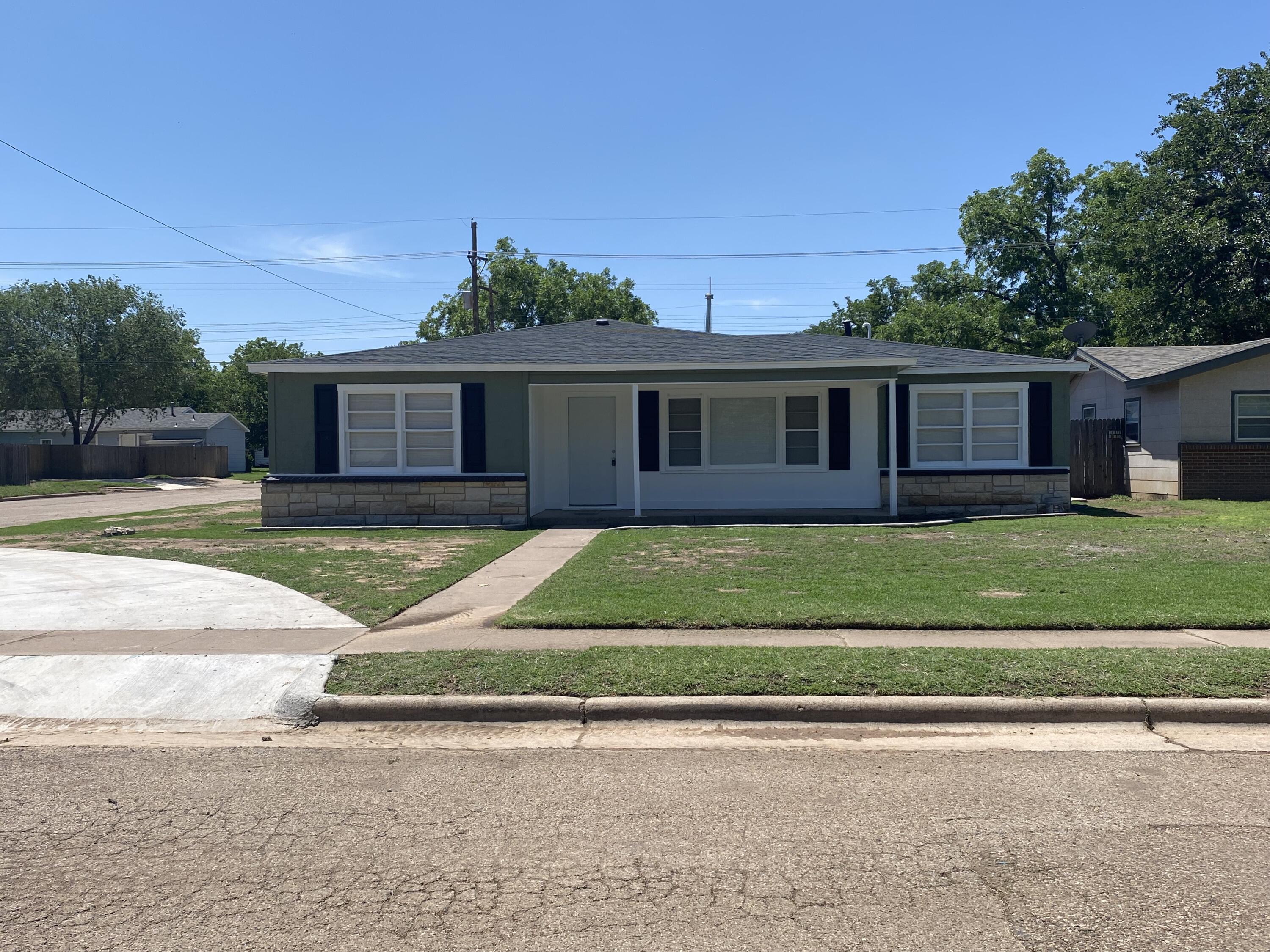4101 32nd Street Lubbock, TX 79410 - Photo 1 of 13 a view of a house with a yard and large tree