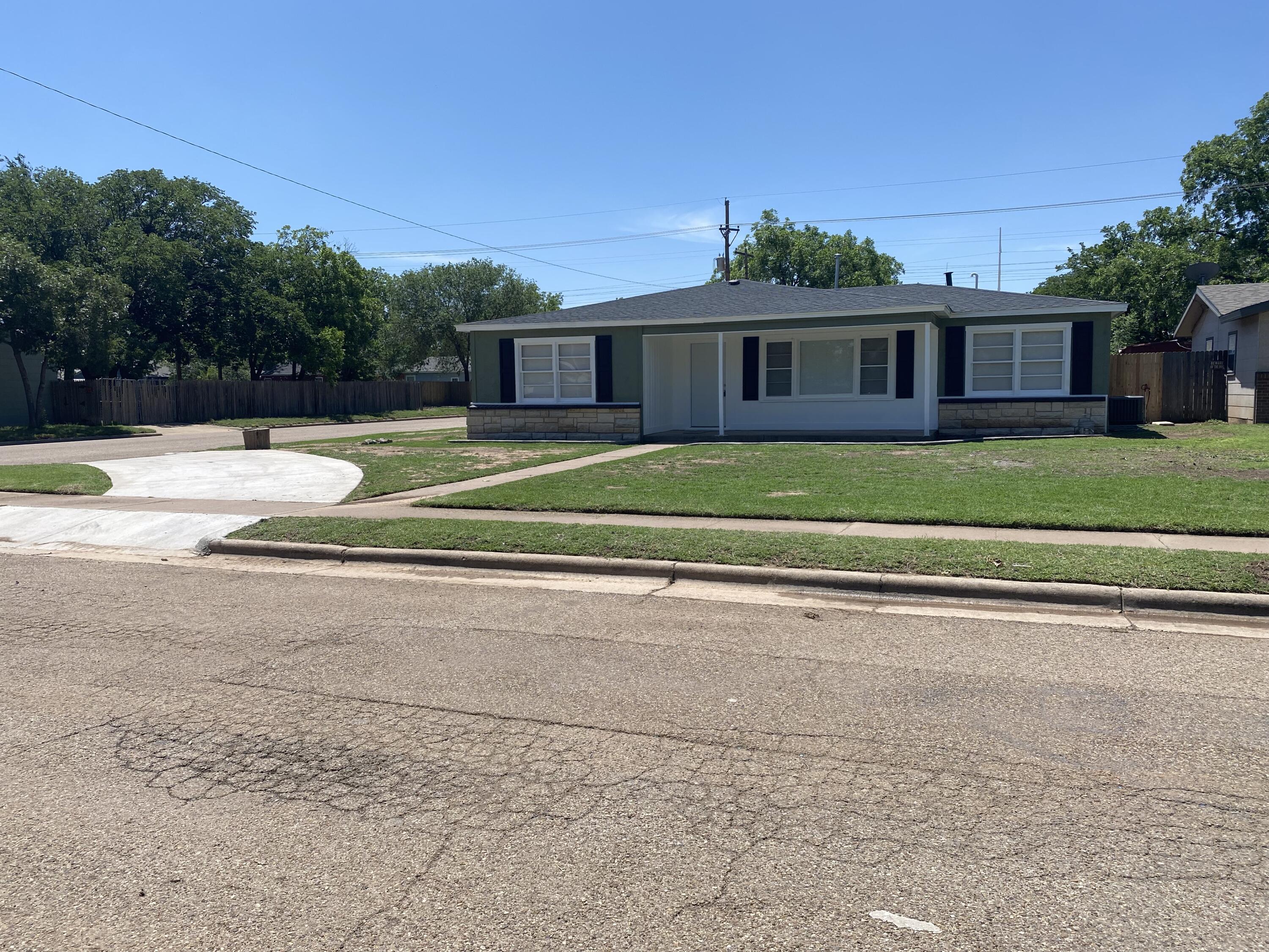 4101 32nd Street Lubbock, TX 79410 - Photo 2 of 13 a front view of a house with a yard