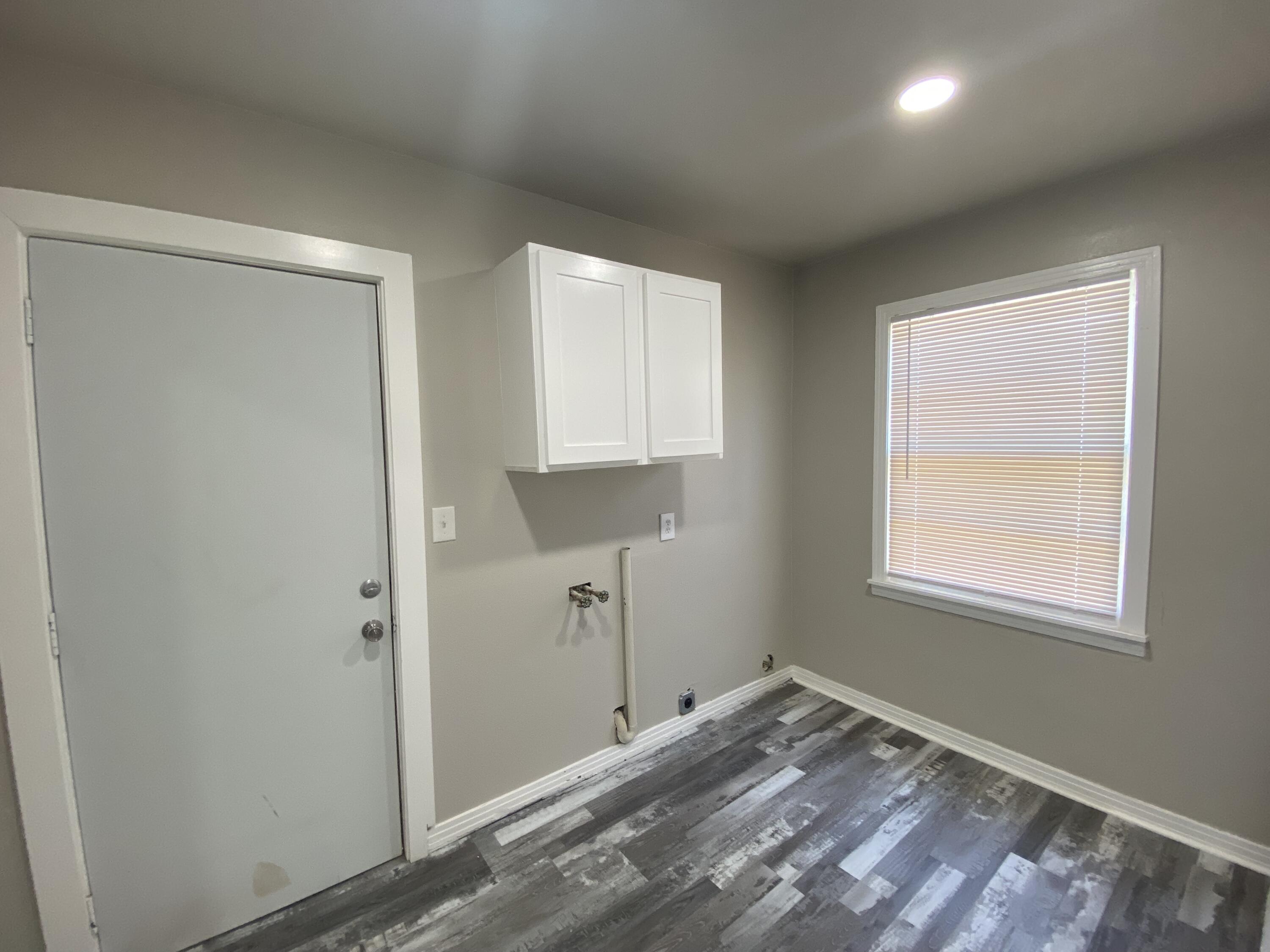 4101 32nd Street Lubbock, TX 79410 - Photo 6 of 13 a view of a room that has a window in it
