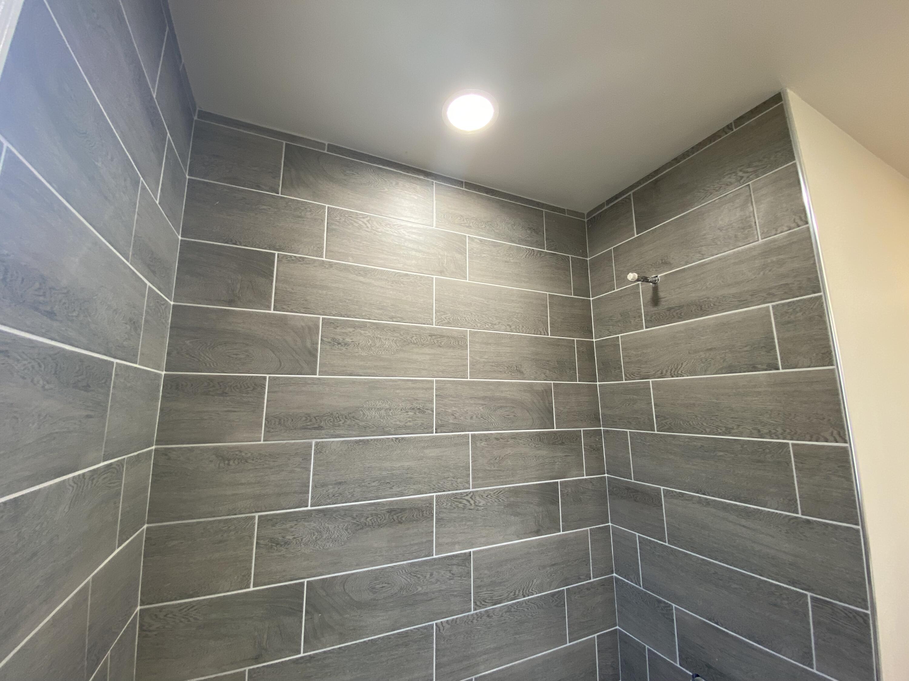 4101 32nd Street Lubbock, TX 79410 - Photo 9 of 13 a bathroom with a shower