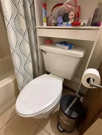 a bathroom with a toilet and a sink