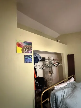 a view of a bedroom with a bed