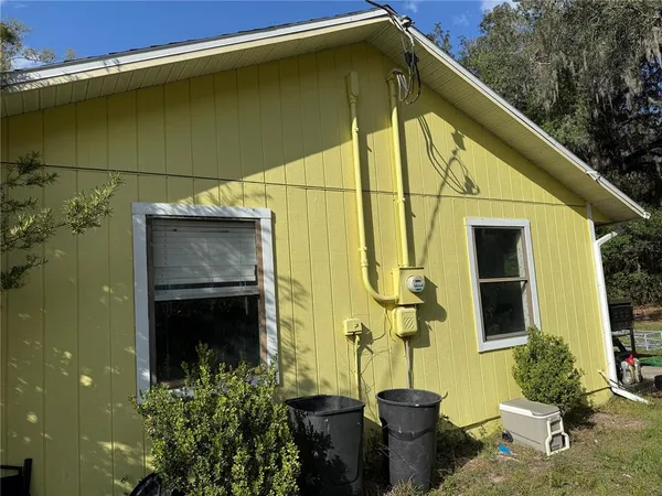 a backyard of a house with seating space