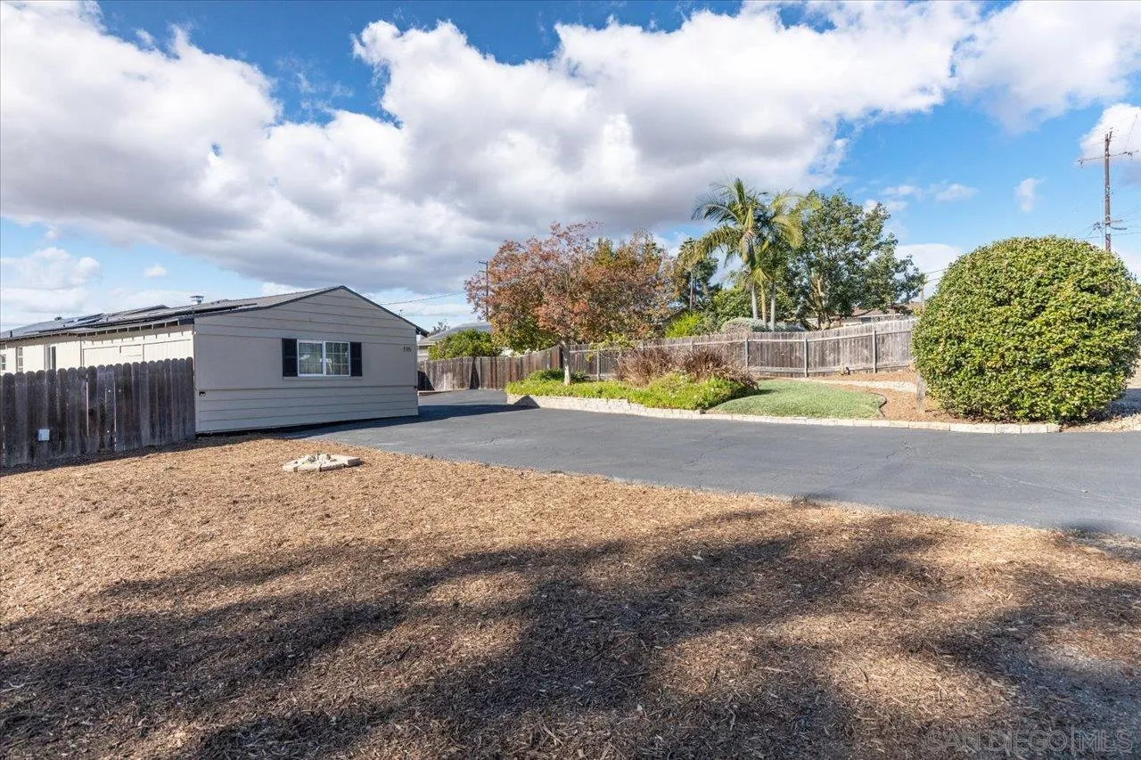 115 Ellis Lane Fallbrook, CA 92028 - Photo 33 of 36 a view of a house with a big yard and large trees