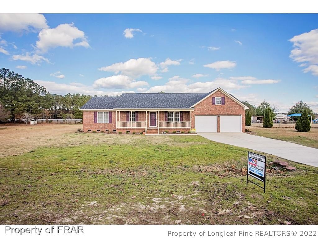4615 Mobius Road Fayetteville, NC 28312 - Photo 1 of 36 a front view of a house with garden