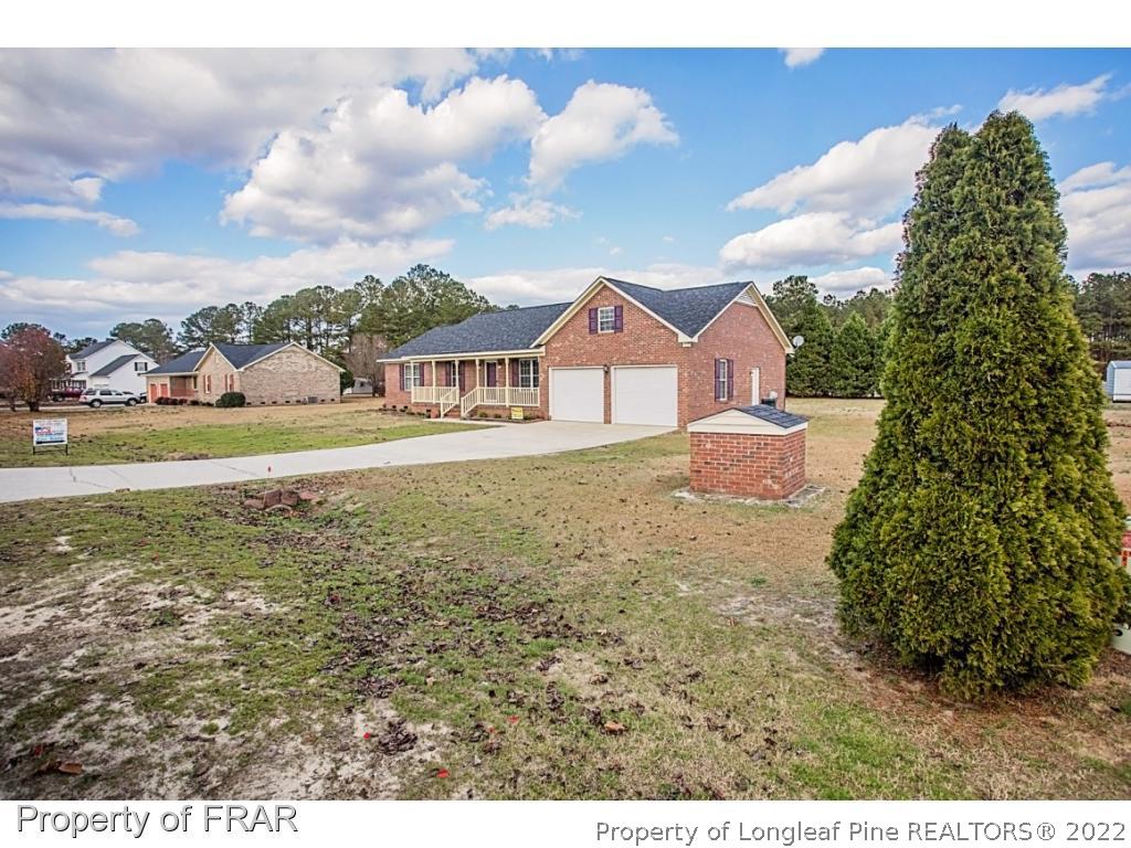 4615 Mobius Road Fayetteville, NC 28312 - Photo 2 of 36 a view of an house with backyard and outdoor space