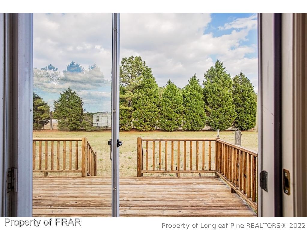 4615 Mobius Road Fayetteville, NC 28312 - Photo 32 of 36 a view of a balcony with wooden floor