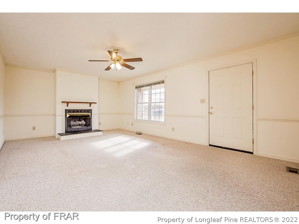4615 Mobius Road Fayetteville, NC 28312 - Photo 7 of 36 a view of a livingroom with a ceiling fan and window