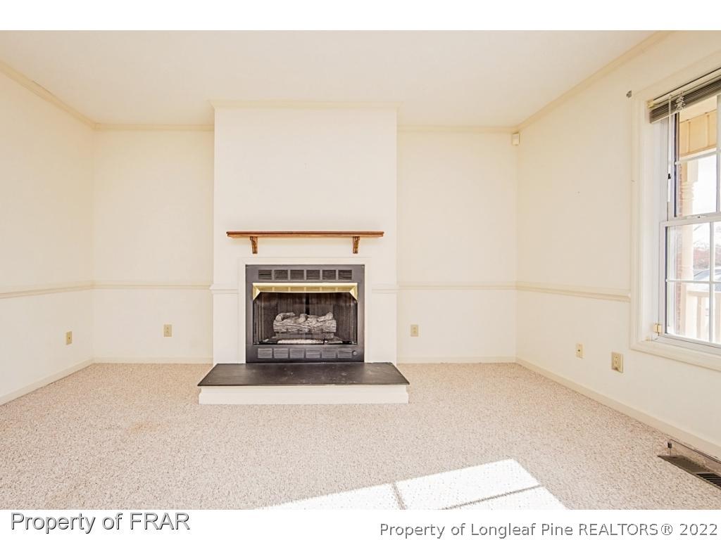 4615 Mobius Road Fayetteville, NC 28312 - Photo 8 of 36 a living room with a fireplace