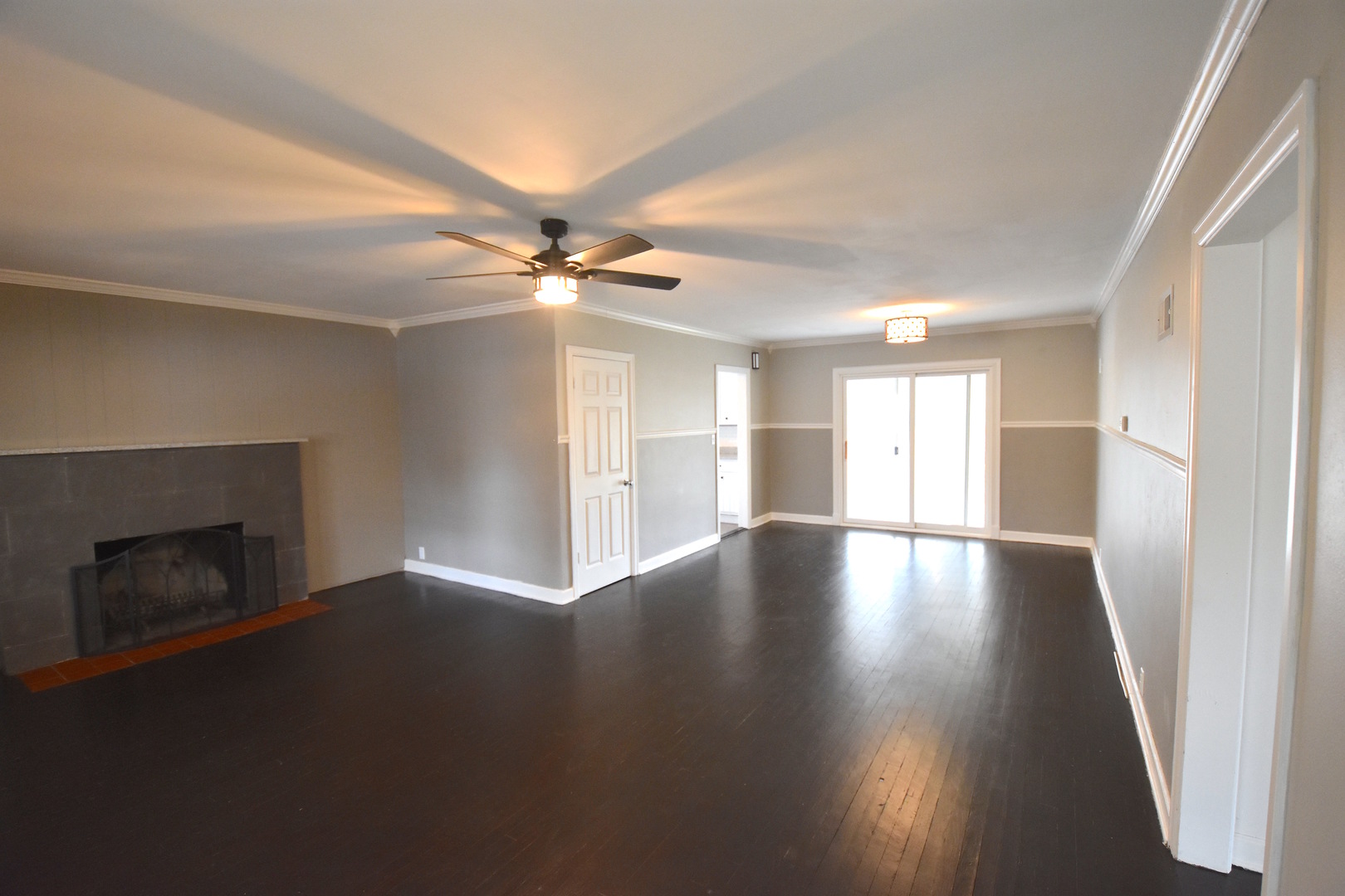 714 Normal Road DeKalb, IL 60115 - Photo 2 of 15 a view of an empty room with wooden floor and a window