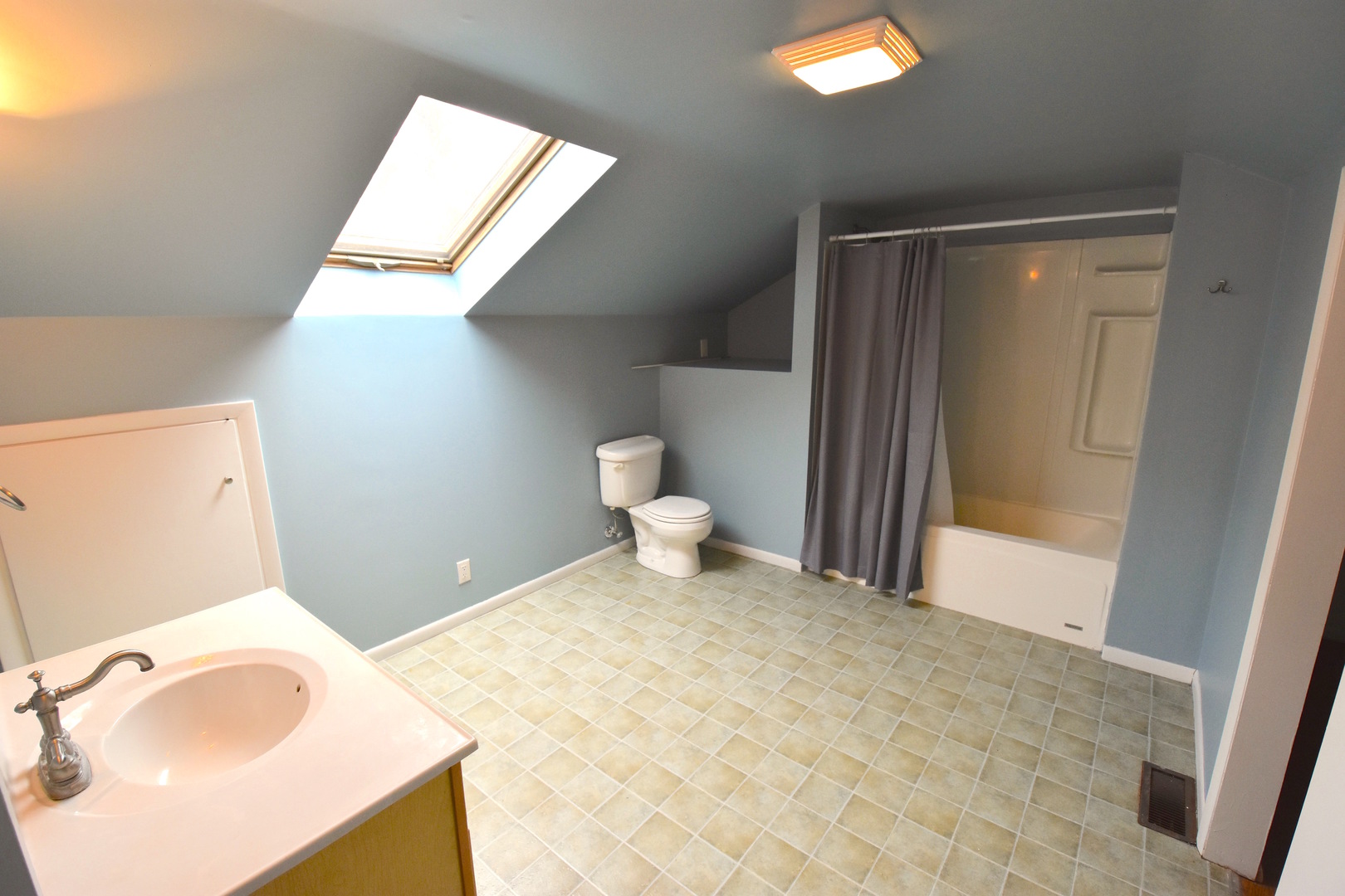 714 Normal Road DeKalb, IL 60115 - Photo 11 of 15 a bathroom with a sink a toilet and a mirror