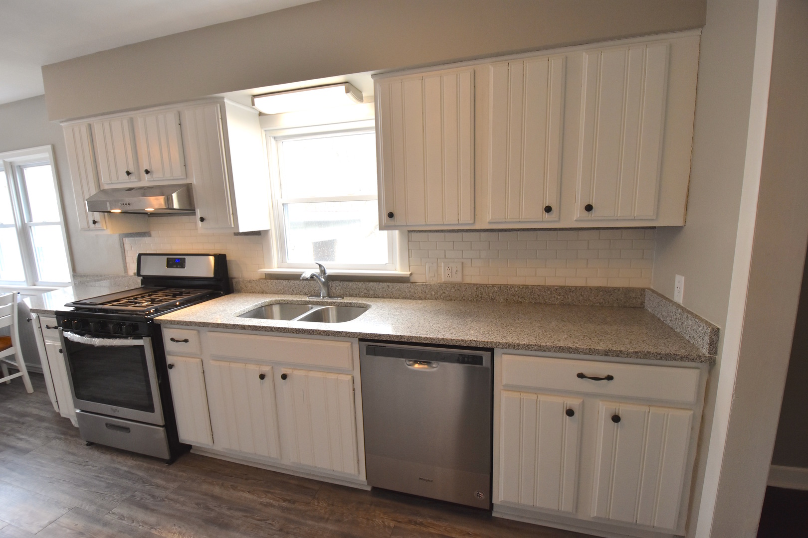 714 Normal Road DeKalb, IL 60115 - Photo 6 of 15 a kitchen with a sink cabinets and window
