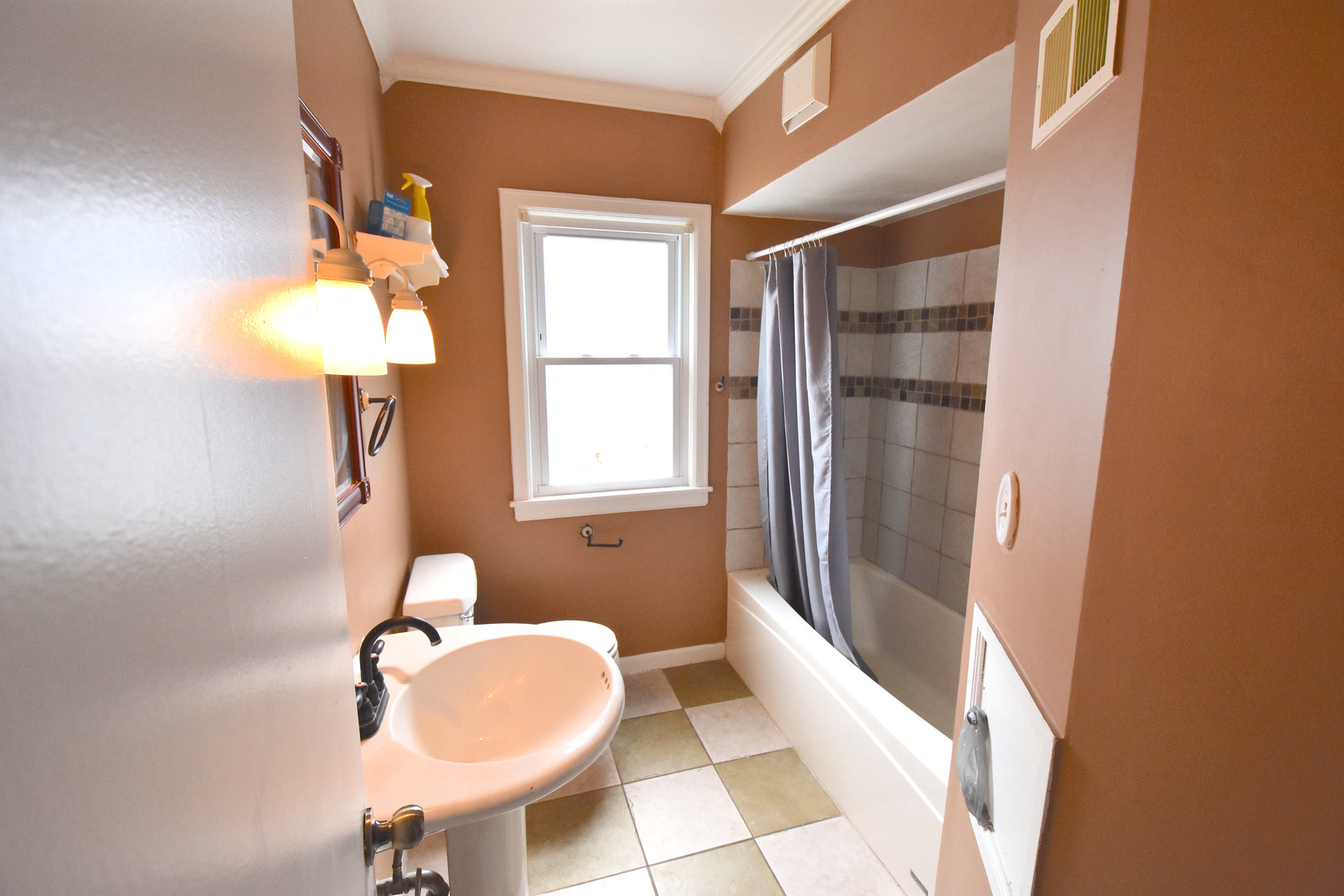 714 Normal Road DeKalb, IL 60115 - Photo 8 of 15 a bathroom with a sink and a mirror