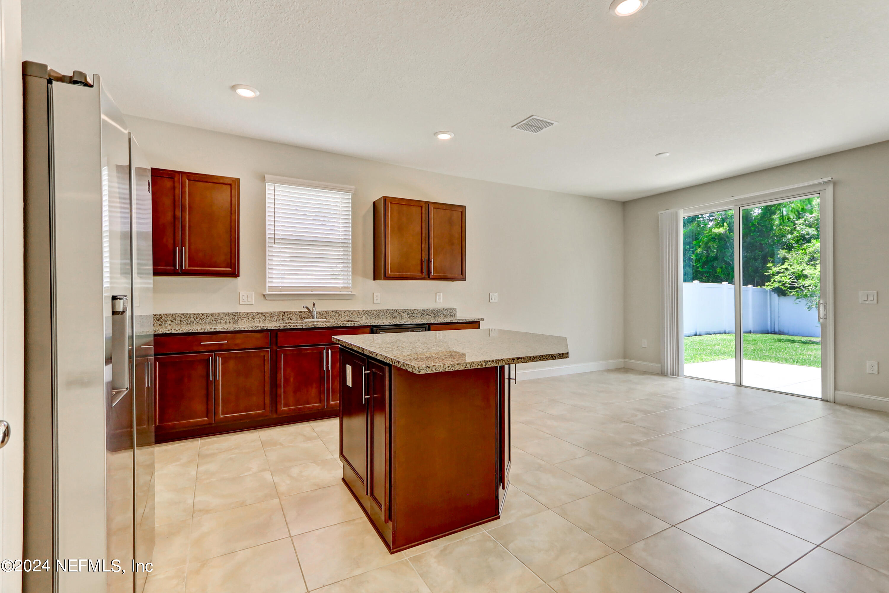 14454 Spring Light Circle Jacksonville, FL 32226 - Photo 17 of 37 a kitchen with stainless steel appliances granite countertop a stove a sink and a microwave