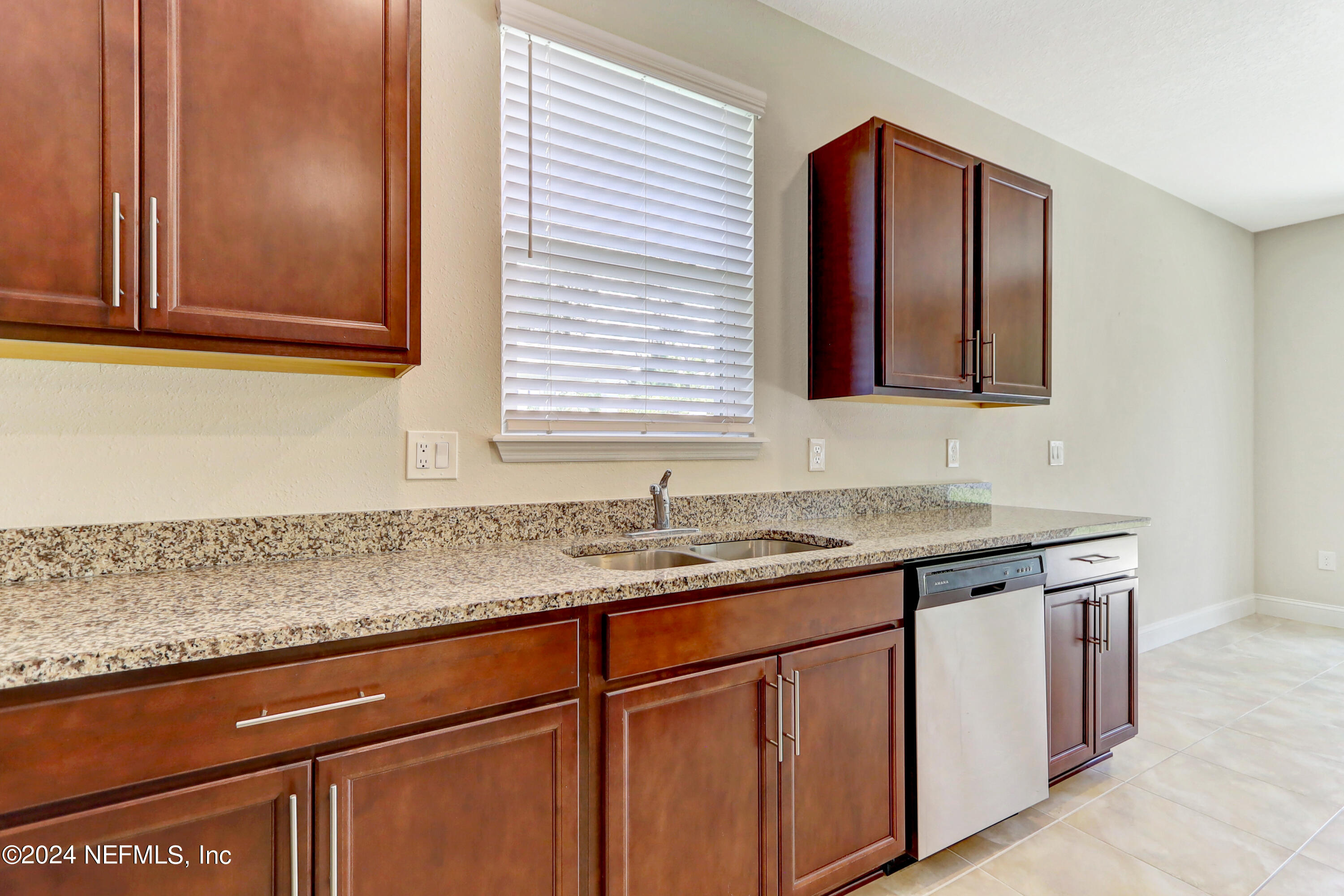 14454 Spring Light Circle Jacksonville, FL 32226 - Photo 20 of 37 a kitchen with granite countertop cabinets sink and window
