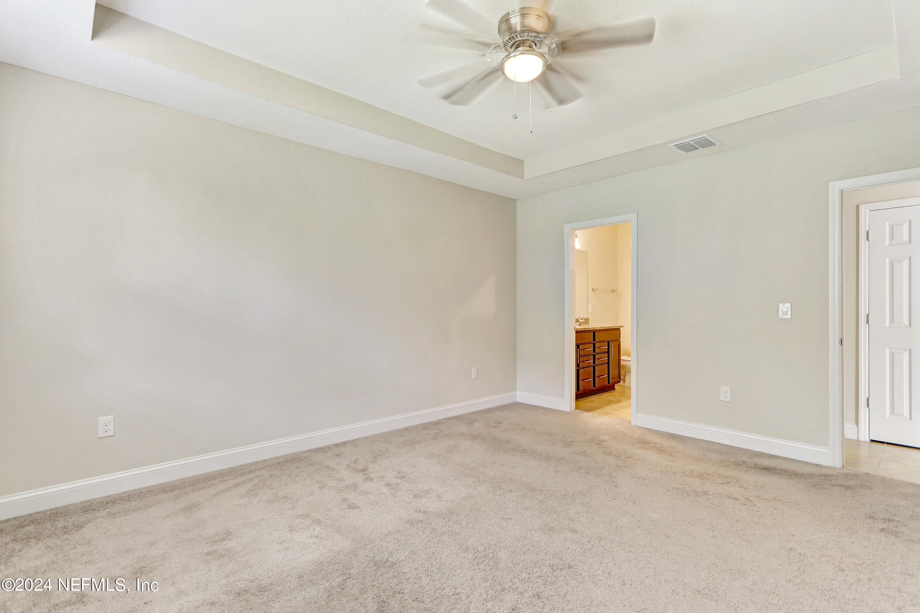 14454 Spring Light Circle Jacksonville, FL 32226 - Photo 23 of 37 an empty room with a ceiling fan and a window