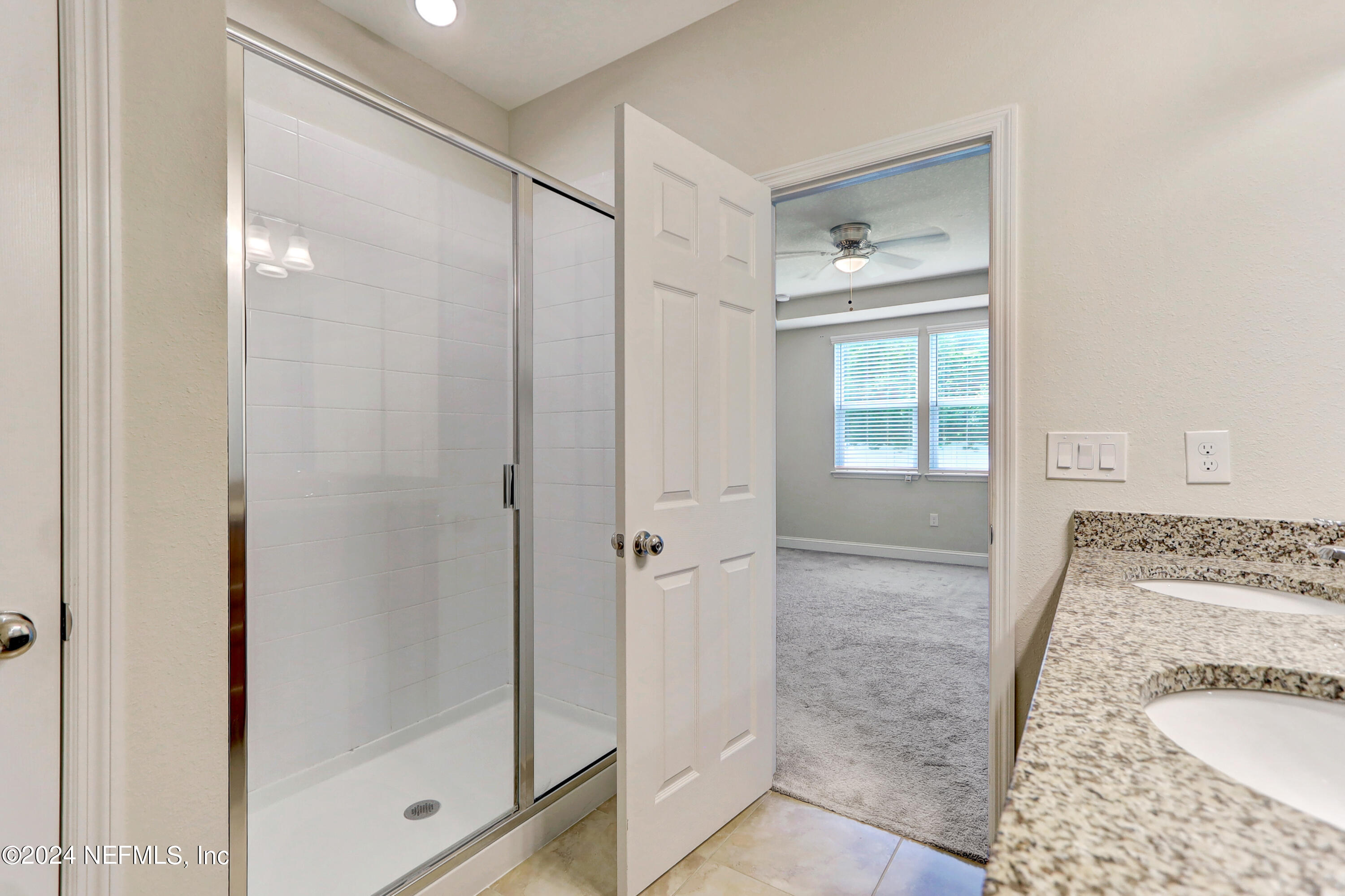 14454 Spring Light Circle Jacksonville, FL 32226 - Photo 27 of 37 a bathroom with a shower and a tub