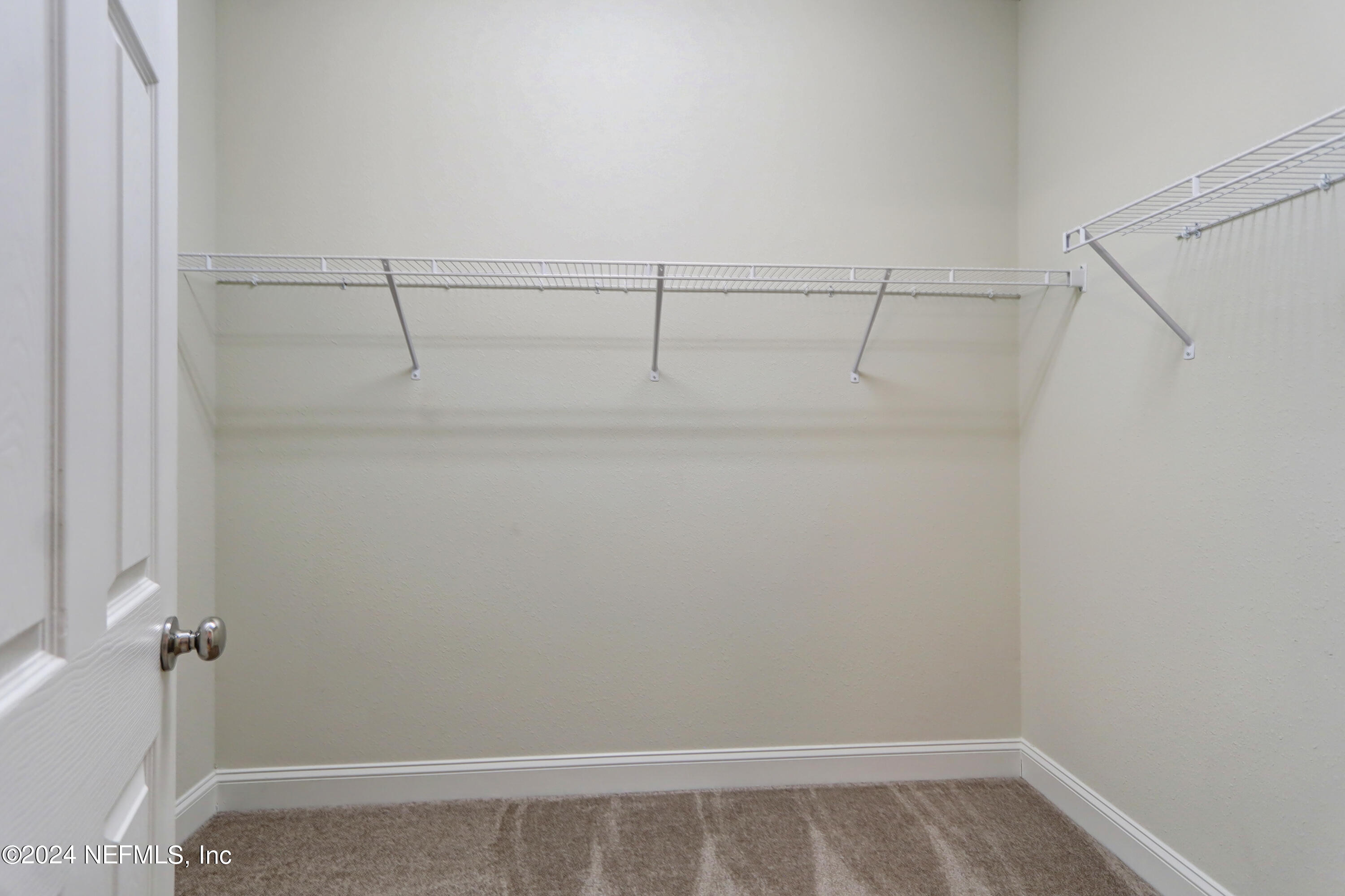 14454 Spring Light Circle Jacksonville, FL 32226 - Photo 28 of 37 a view of a room with racks on the wall