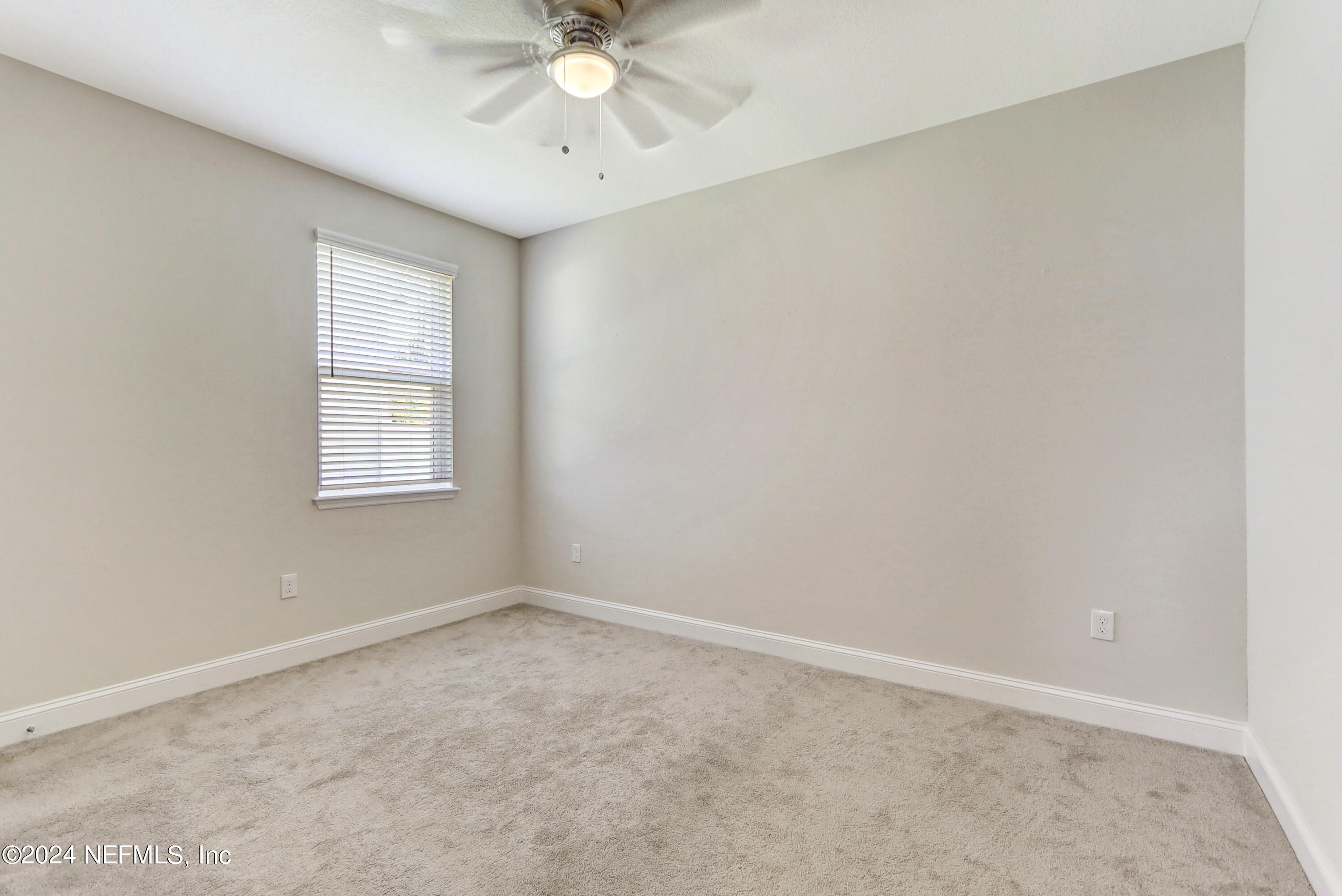 14454 Spring Light Circle Jacksonville, FL 32226 - Photo 32 of 37 an empty room with a window