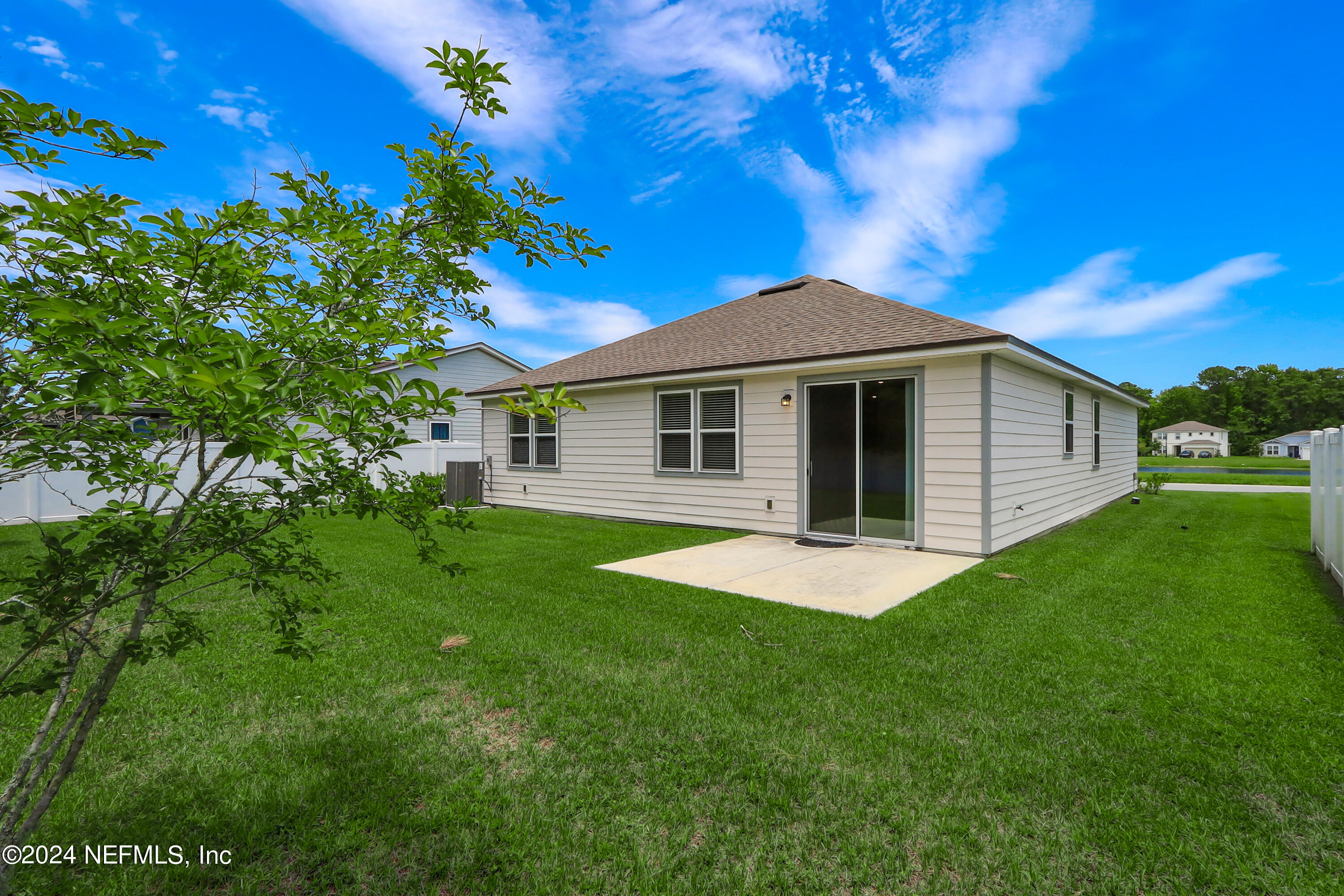 14454 Spring Light Circle Jacksonville, FL 32226 - Photo 35 of 37 a backyard of a house with lots of green space