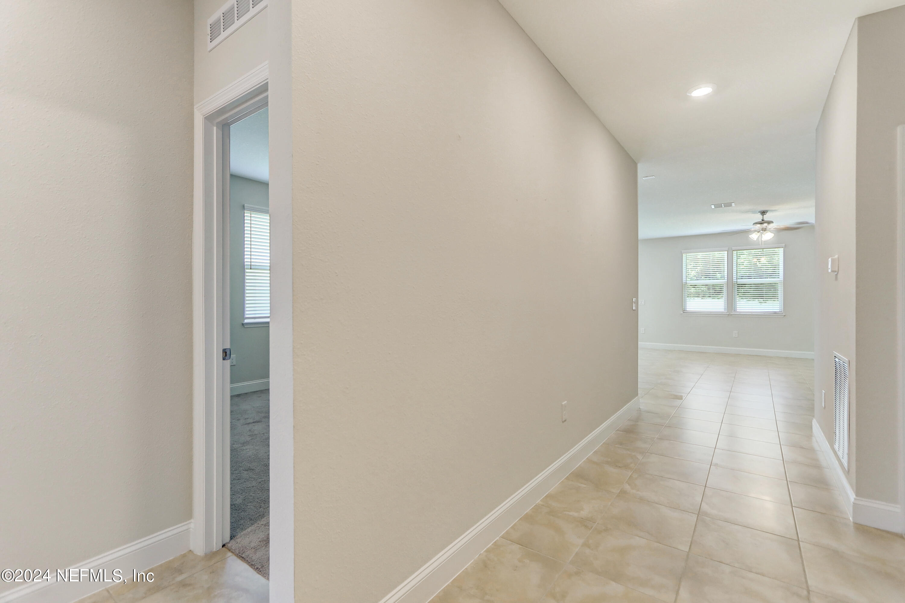 14454 Spring Light Circle Jacksonville, FL 32226 - Photo 6 of 37 an empty room with windows and closet