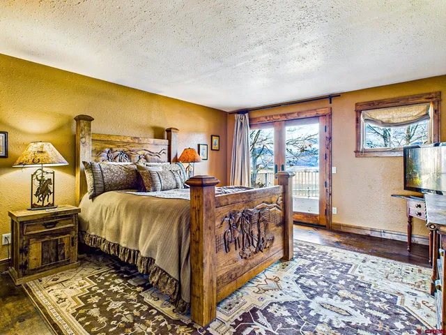 a bed room with a bed and a tv