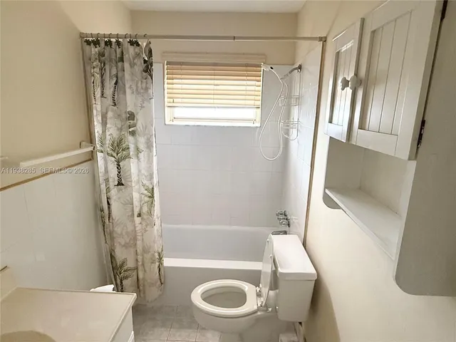 a bathroom with a tub and a shower