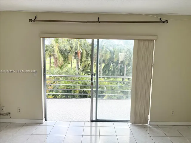 a view of a room with window and a floor to ceiling window