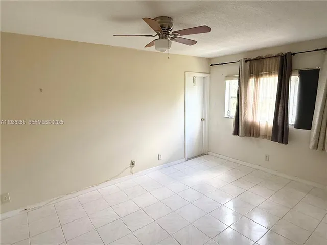 a view of an empty room and window