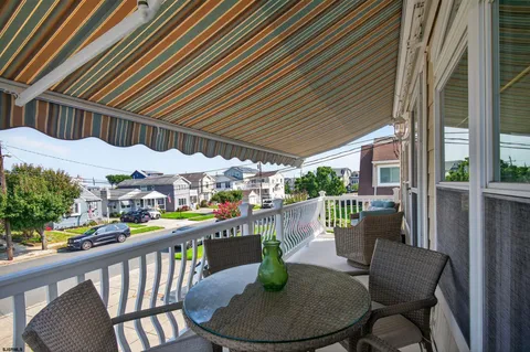 a view of a chairs and table in patio