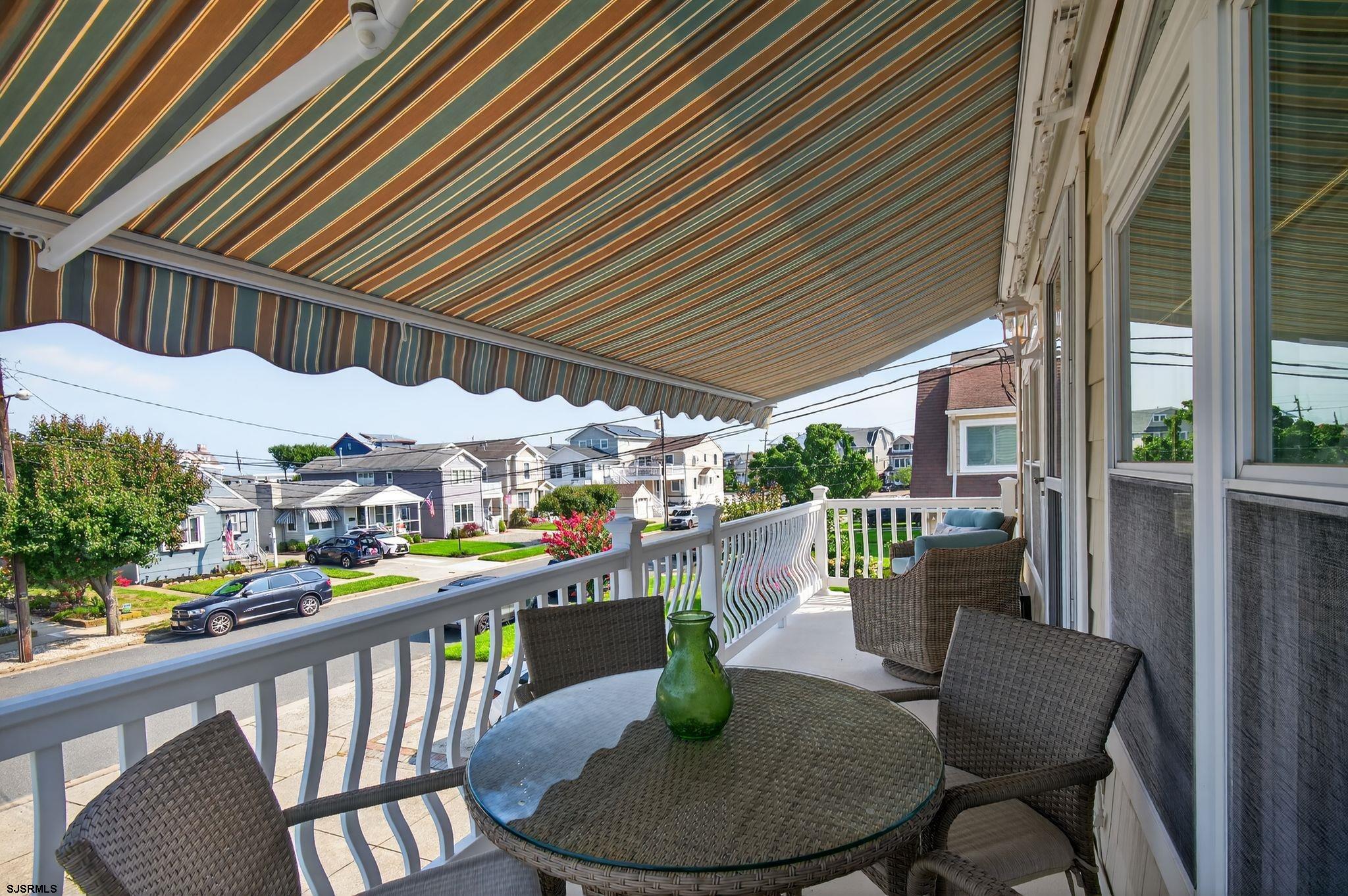 51 Simpson Road, Unit 2 Ocean City, NJ 08226 - Photo 4 of 43 a view of a chairs and table in the balcony