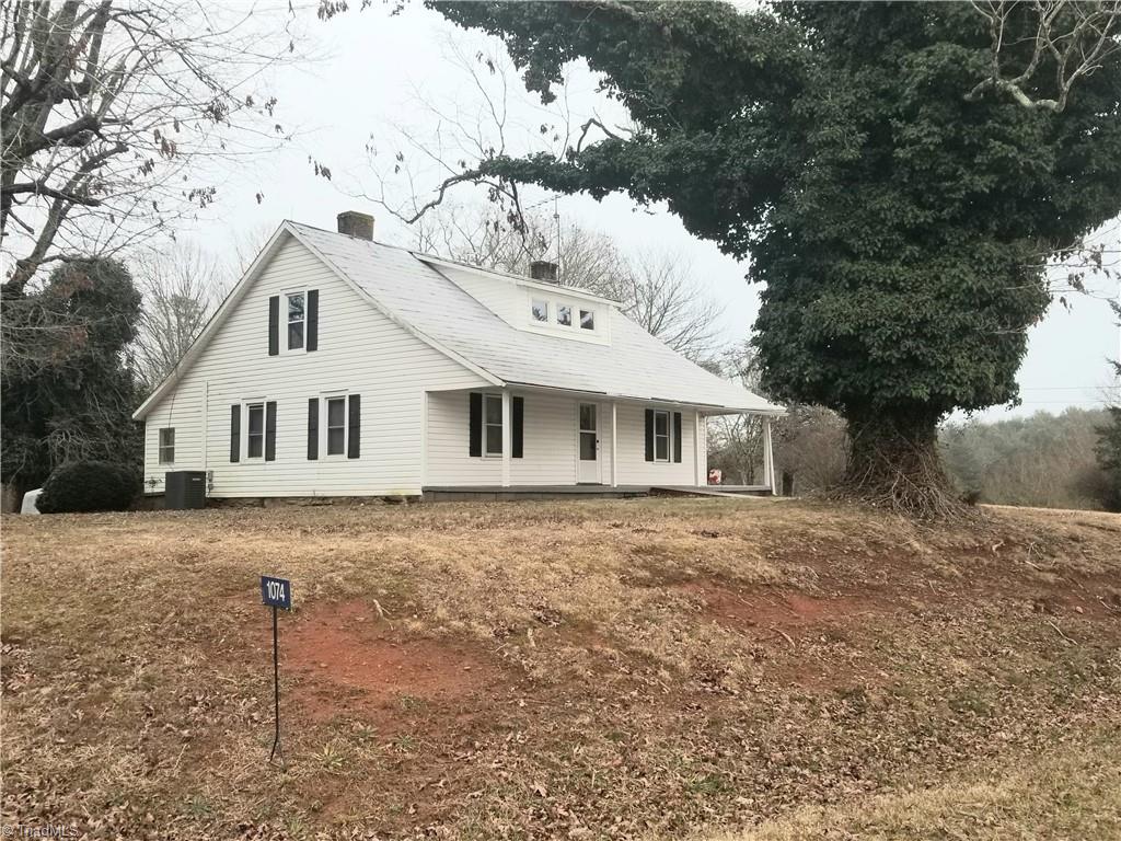 1074 Locust Grove Road Westfield, NC 27053 - Photo 1 of 21 View from left side