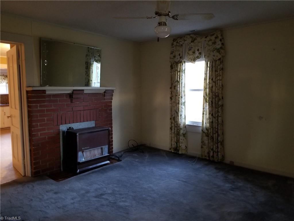 1074 Locust Grove Road Westfield, NC 27053 - Photo 9 of 21 Living Room. Gas furnace stays as a back up to the heat pump