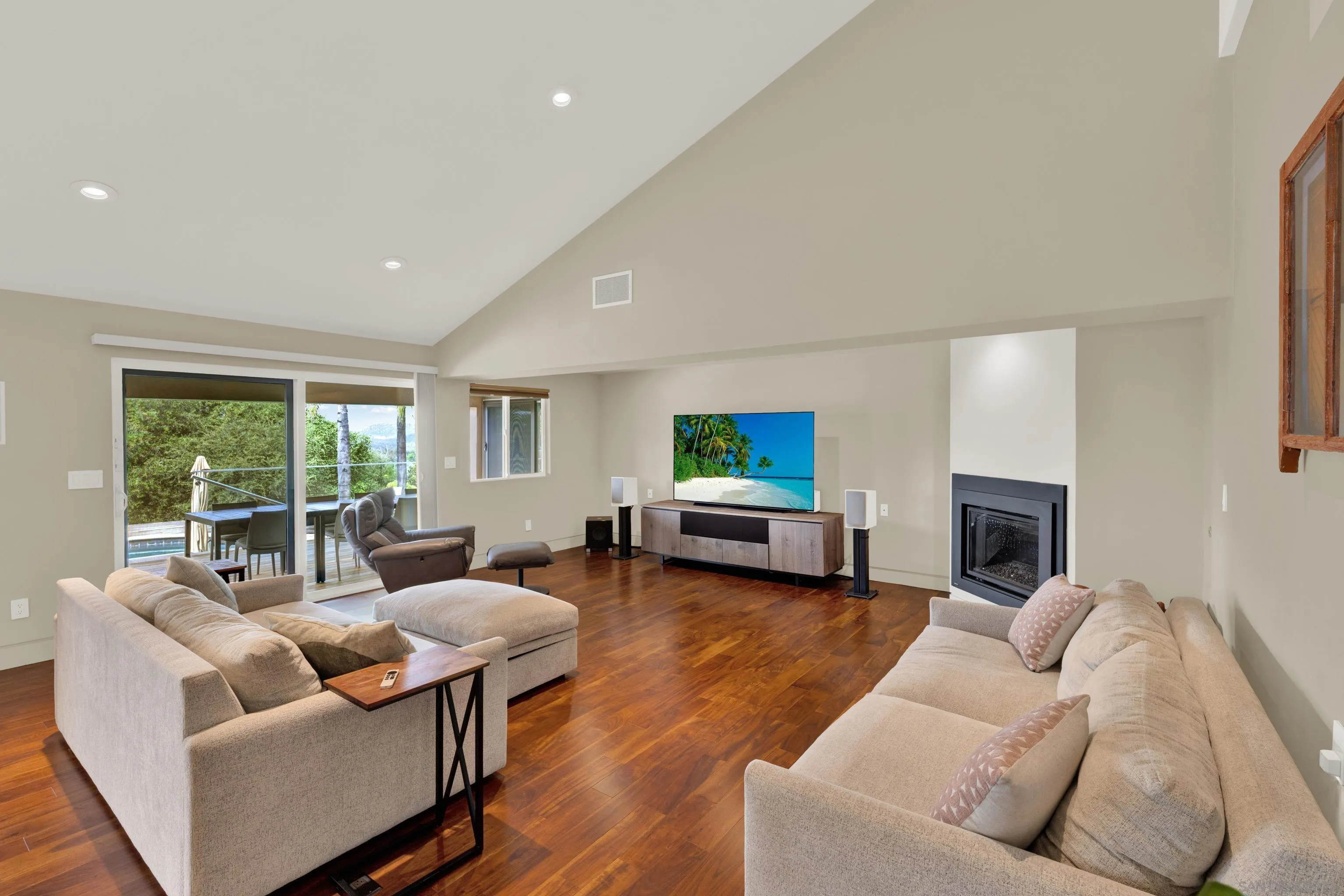 16117 Martincoit Road Poway, CA 92064 - Photo 22 of 73 a living room with furniture a fireplace and a flat screen tv