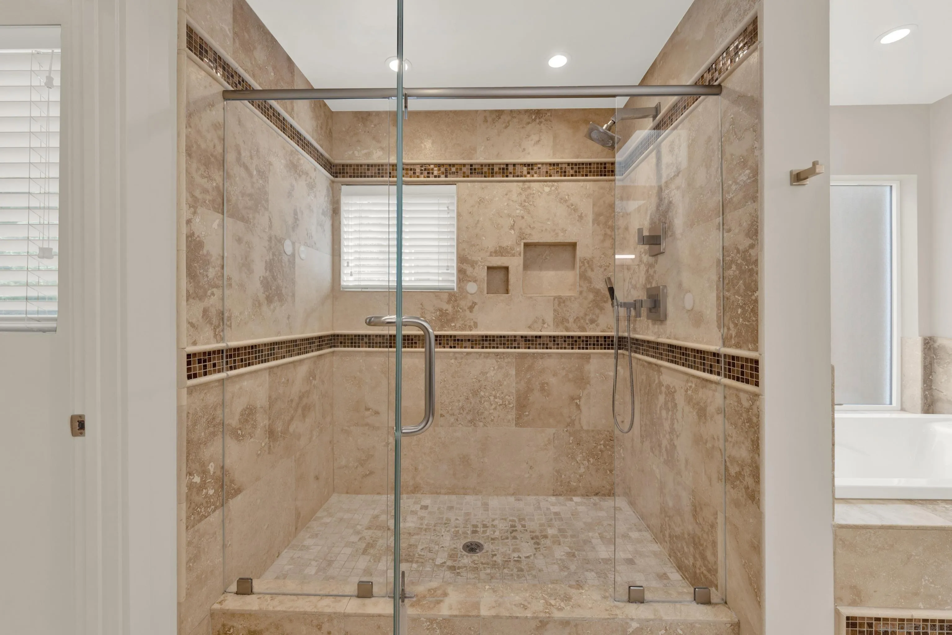 16117 Martincoit Road Poway, CA 92064 - Photo 30 of 73 a bathroom with a shower and a glass door