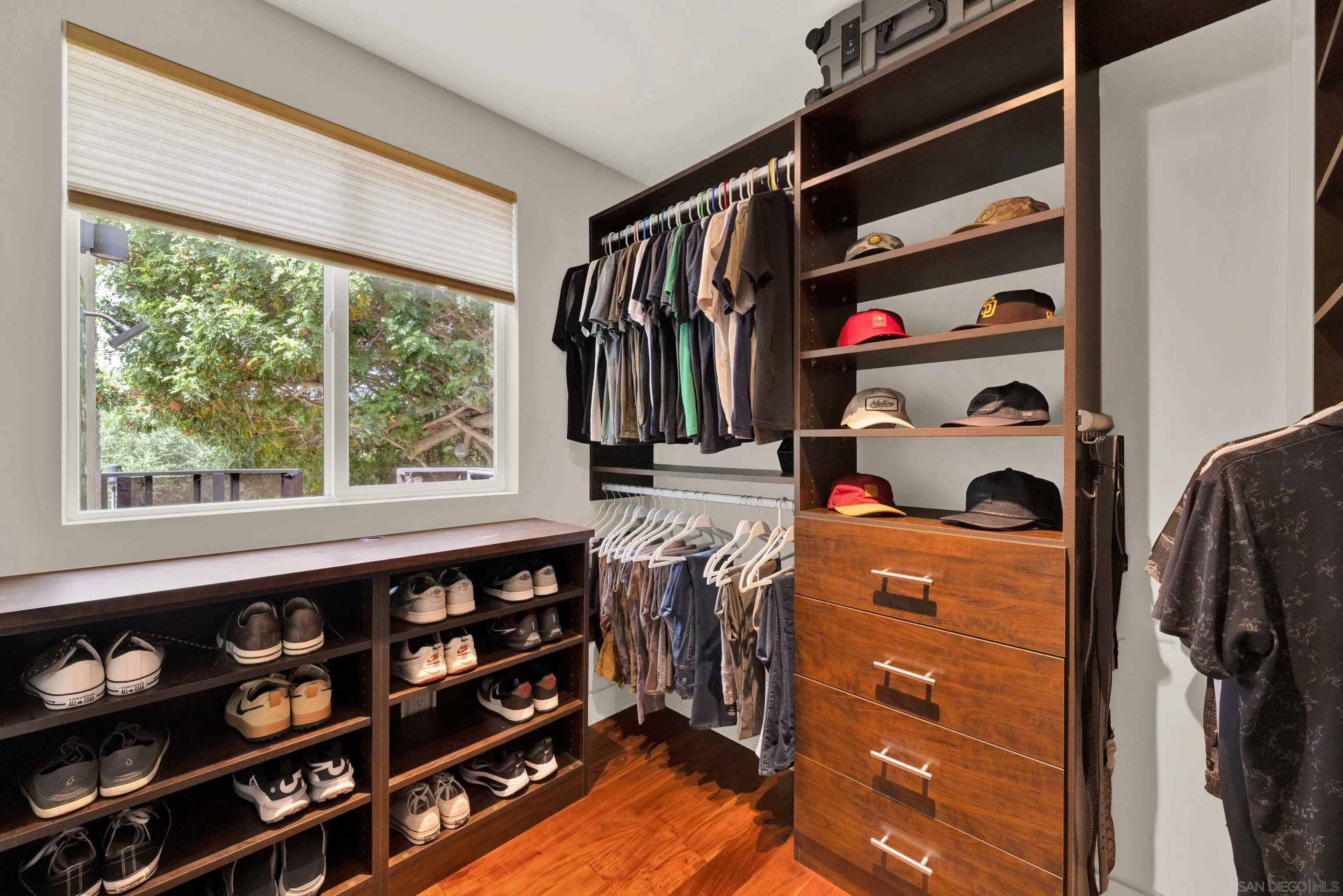 16117 Martincoit Road Poway, CA 92064 - Photo 31 of 73 a view of walk in closet with clothes and shoes