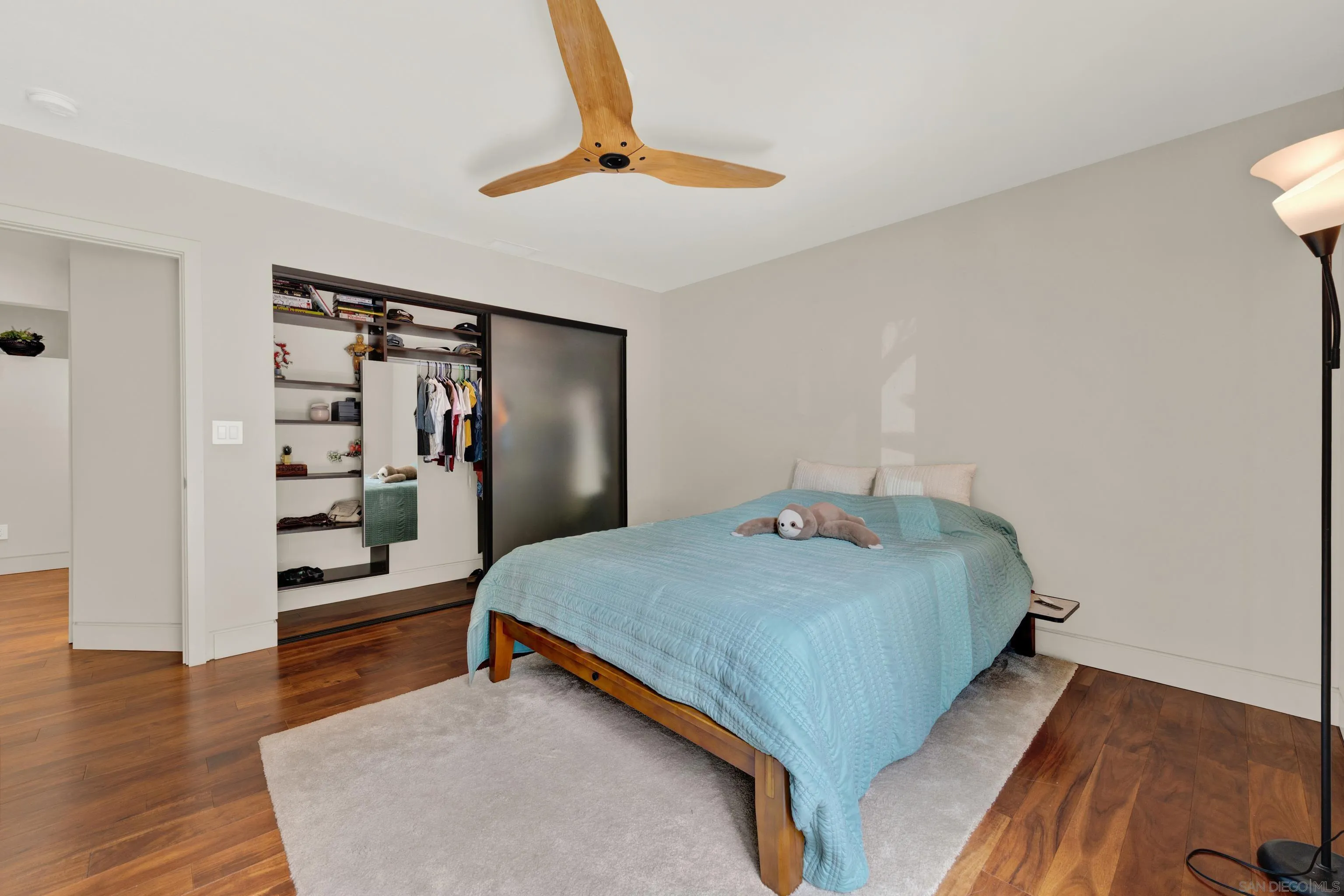 16117 Martincoit Road Poway, CA 92064 - Photo 39 of 73 a bedroom with a bed and a book shelf