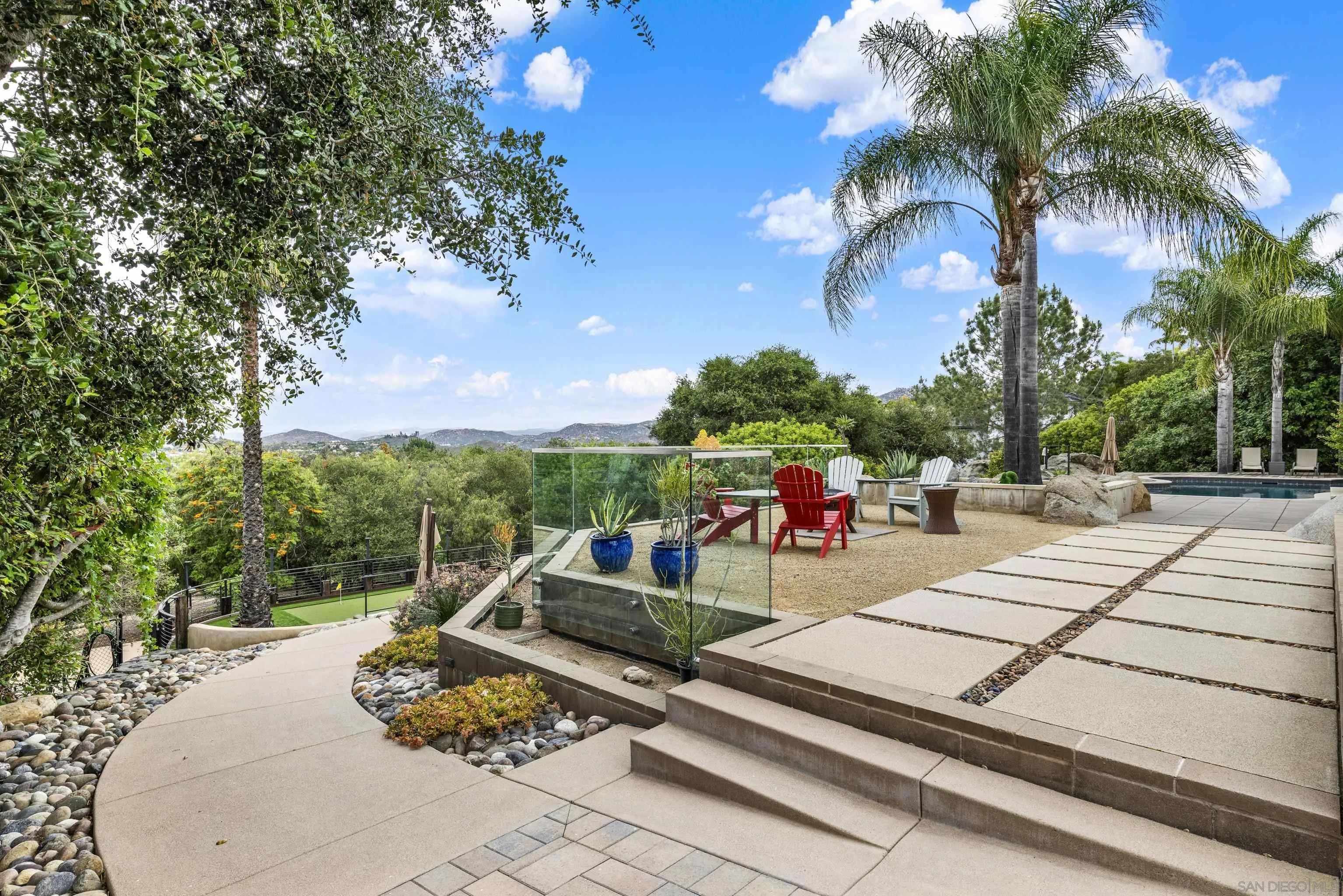 16117 Martincoit Road Poway, CA 92064 - Photo 60 of 73 a view of a patio with swimming pool