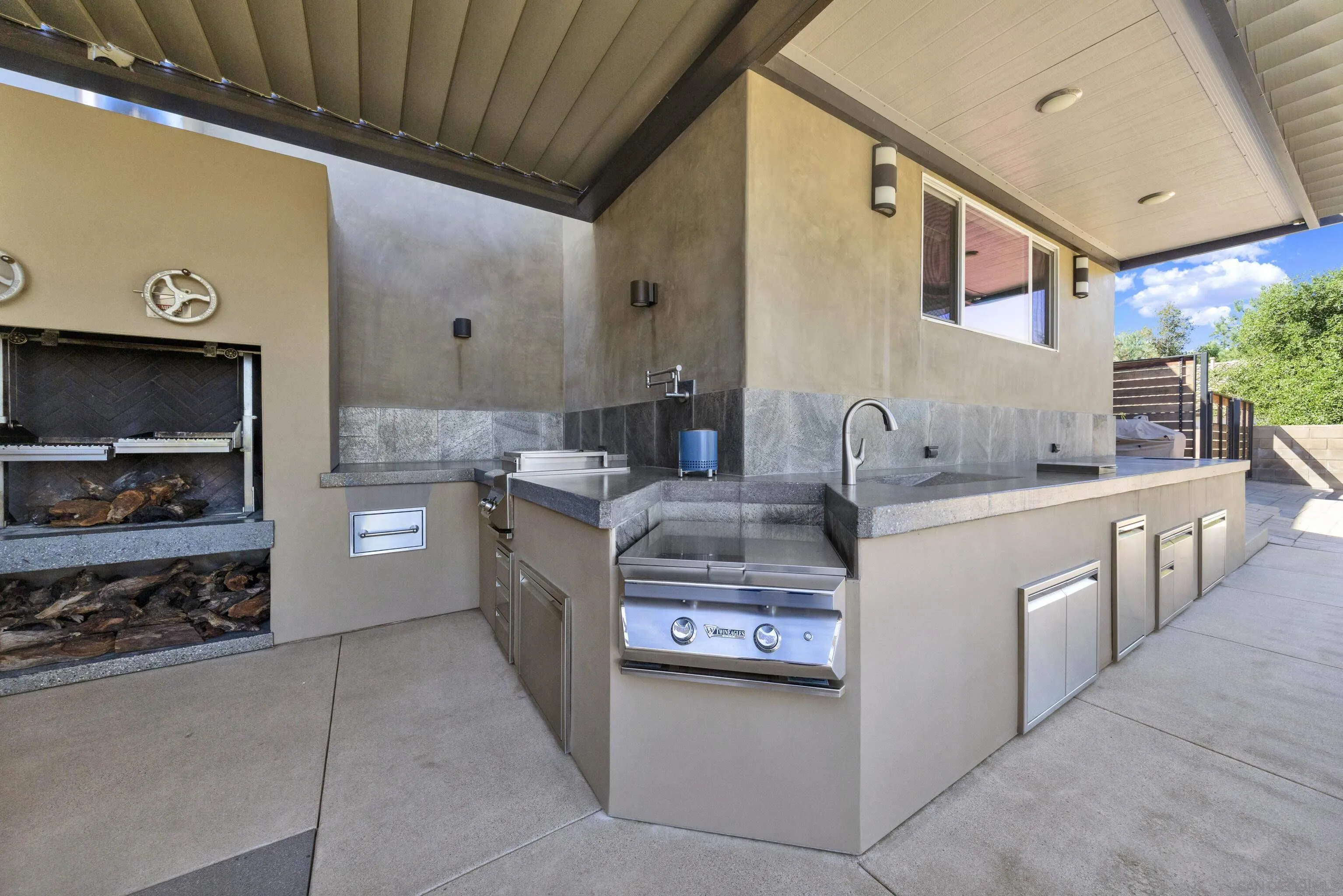 16117 Martincoit Road Poway, CA 92064 - Photo 65 of 73 a kitchen with kitchen island granite countertop a sink counter top space and stainless steel appliances