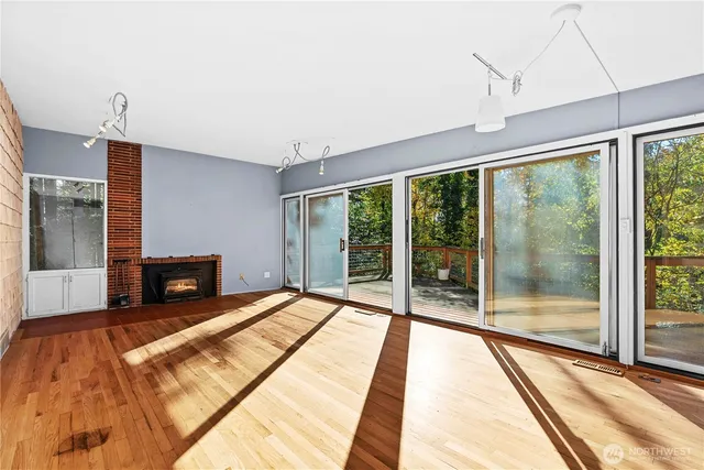 a spacious bedroom with a large bed and a large window