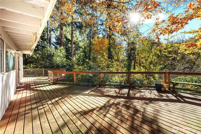 a view of a balcony with wooden floor