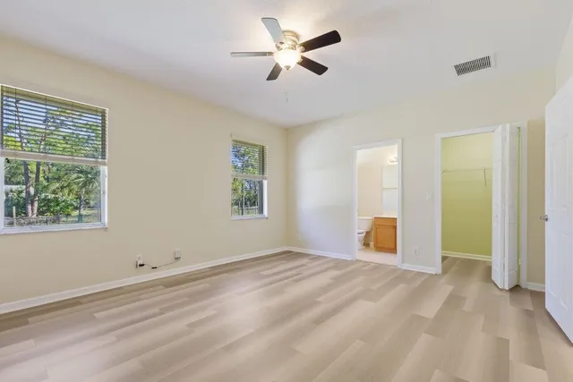 a view of room with window and ceiling fan