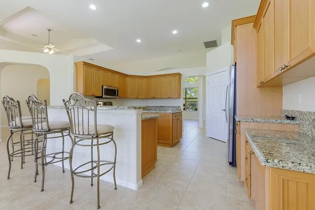 a bathroom with bathtub and window